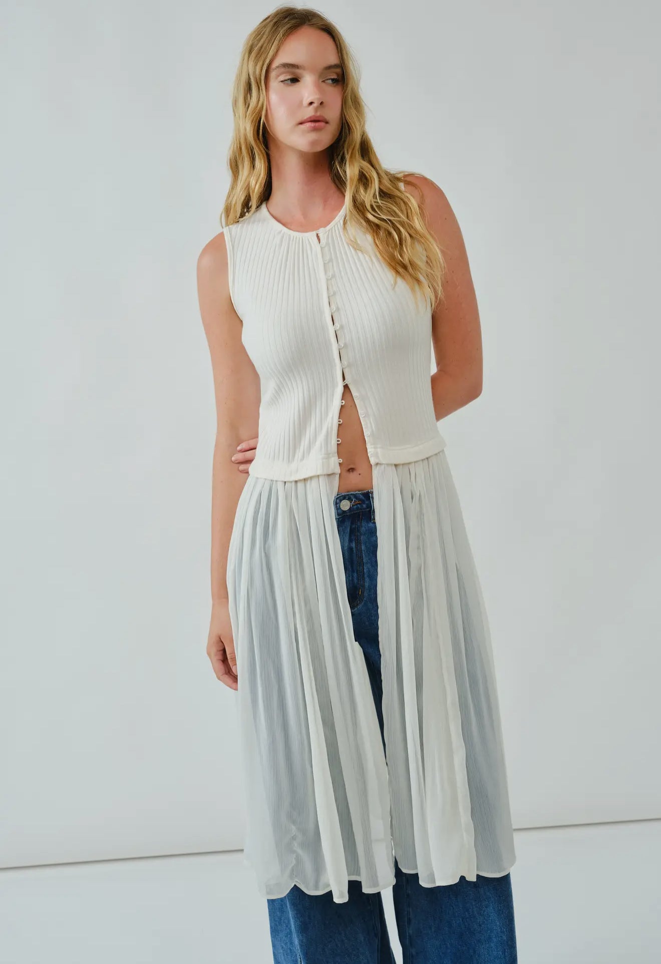 Knit Sleevless Button Down
Mixed Media