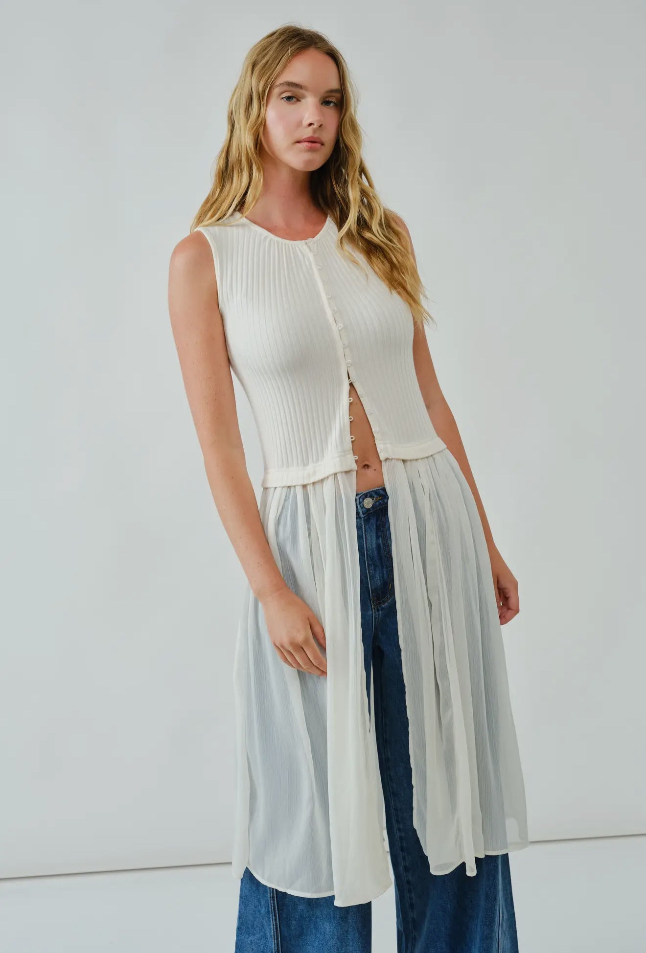 Knit Sleevless Button Down
Mixed Media