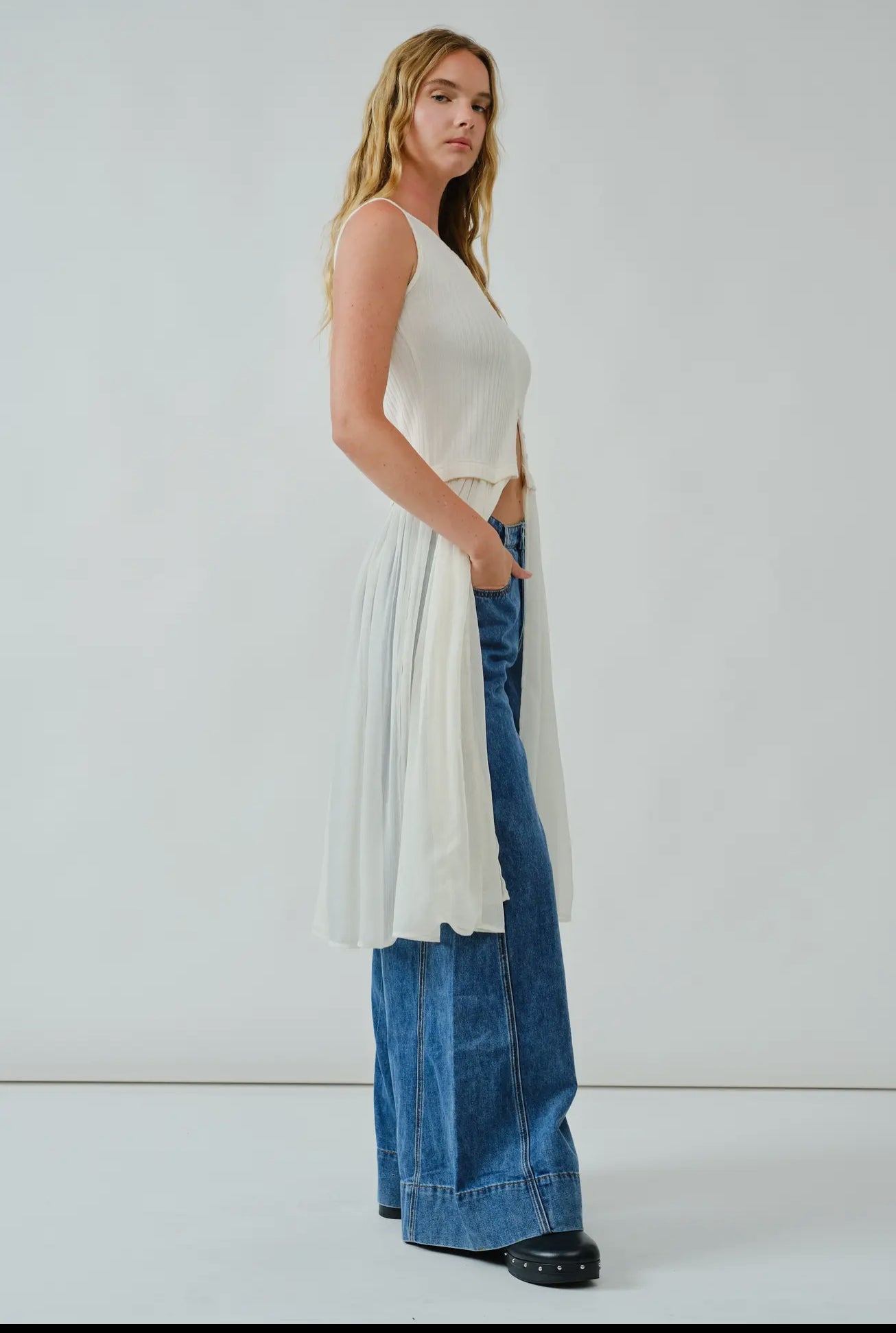 Knit Sleevless Button Down
Mixed Media