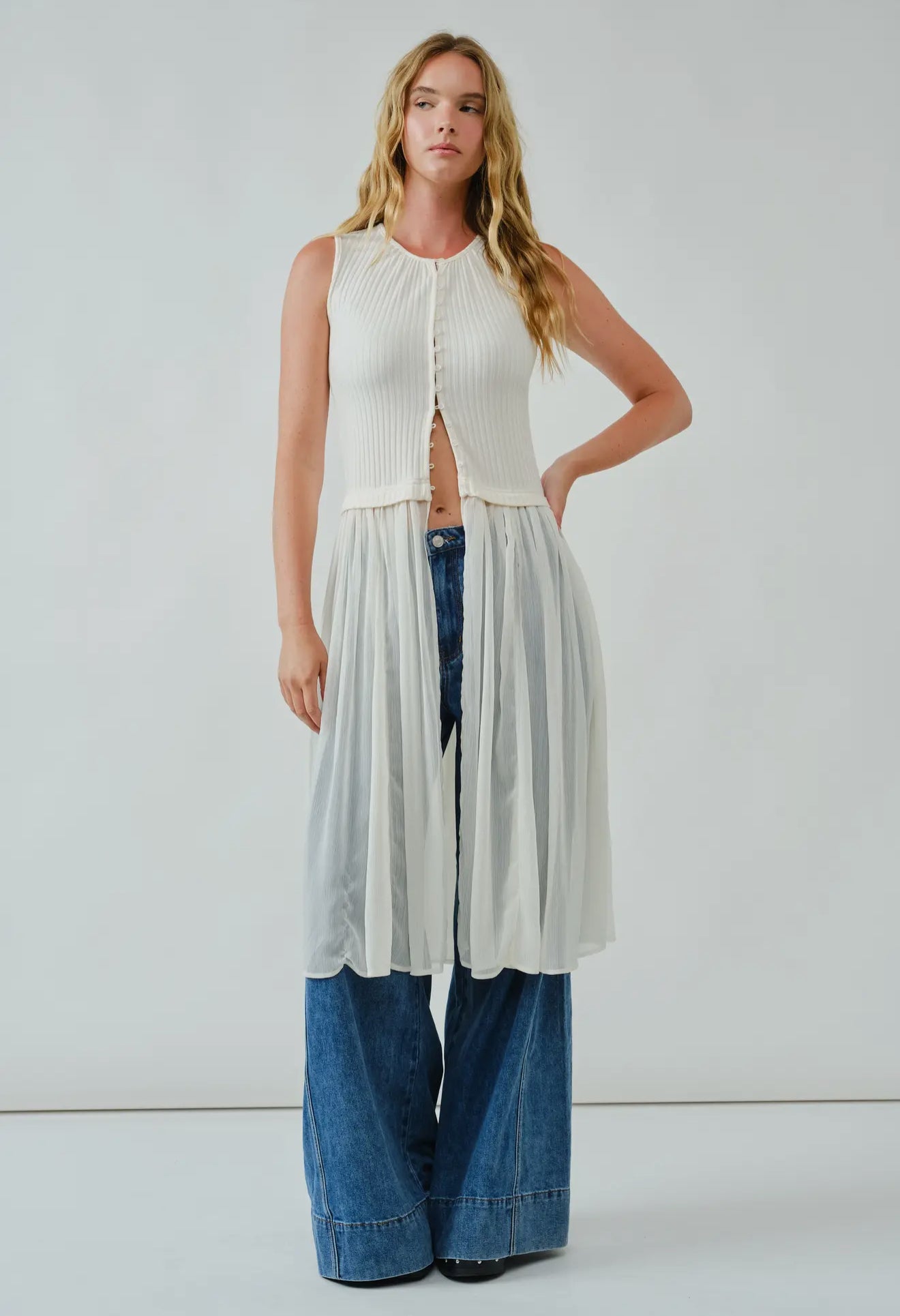 Knit Sleevless Button Down
Mixed Media