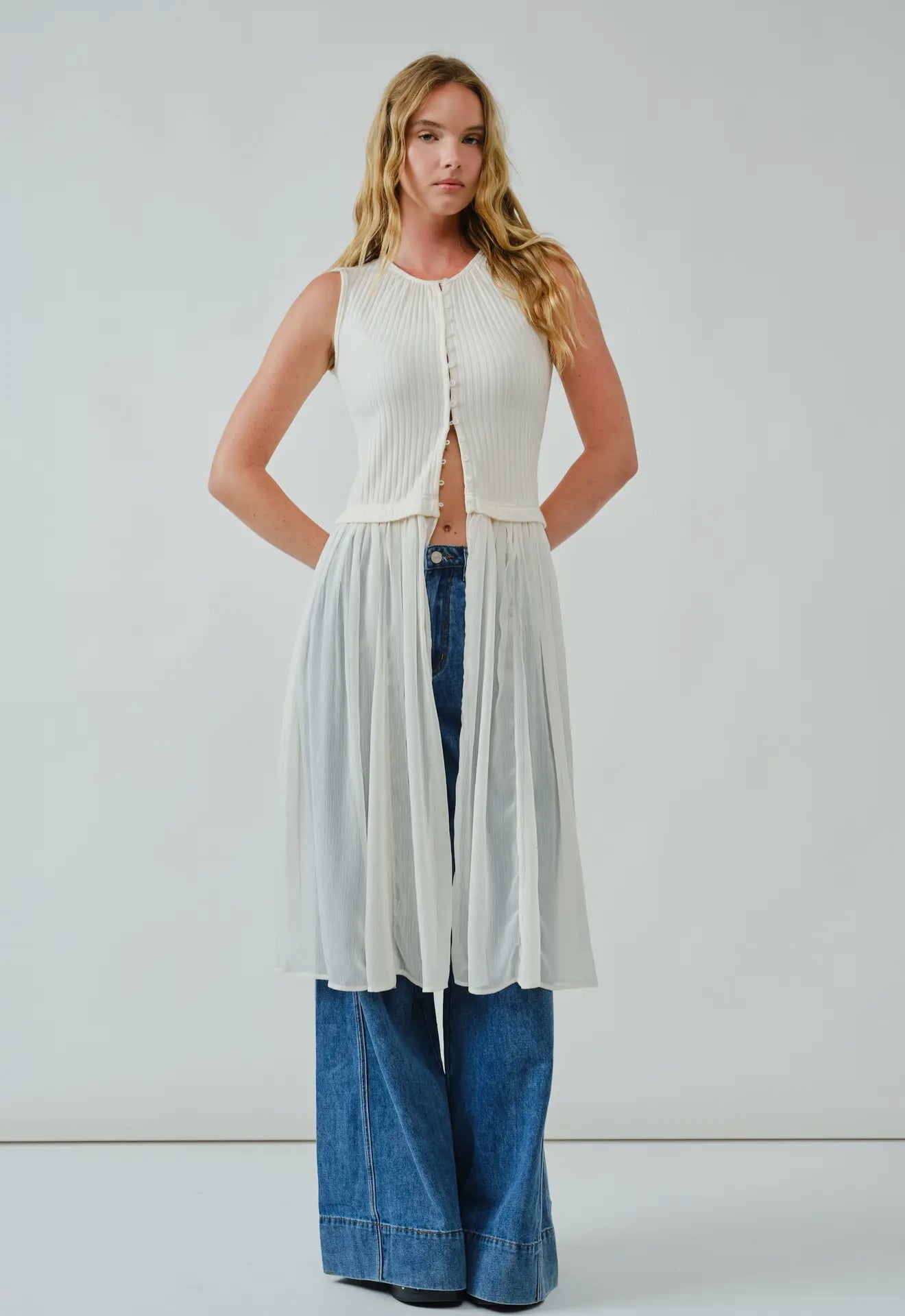 Knit Sleevless Button Down
Mixed Media